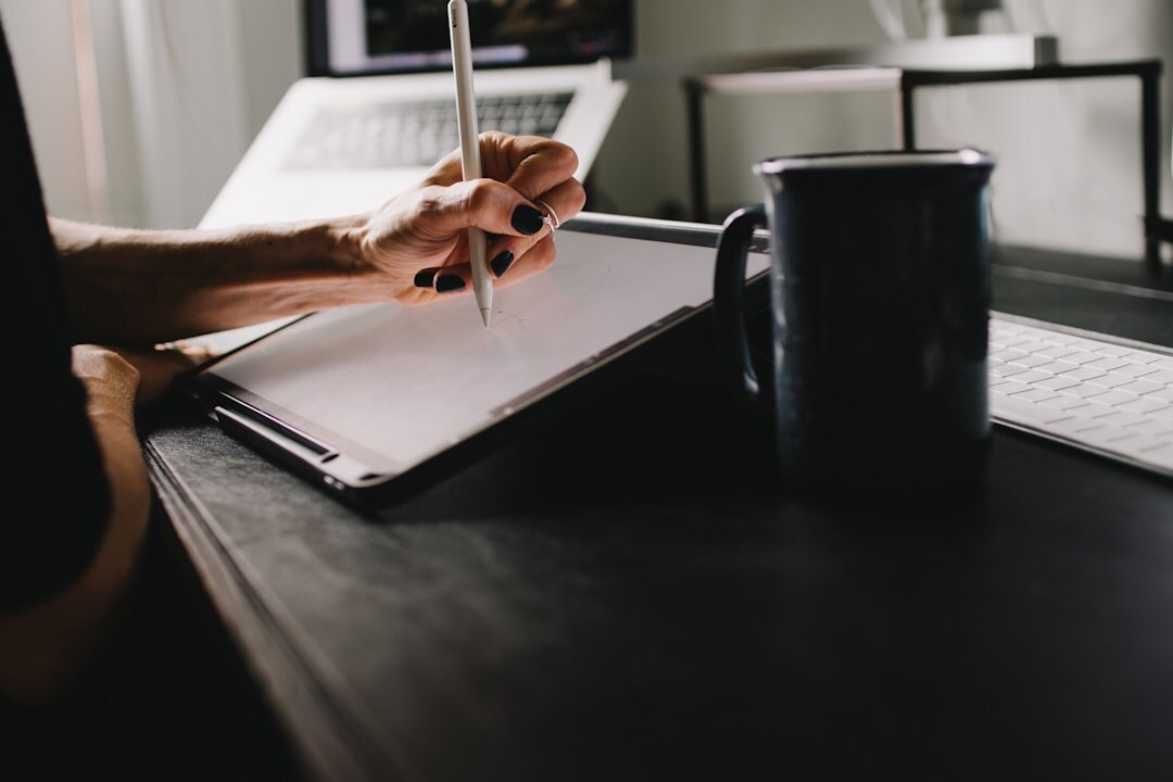 Person writing at desk